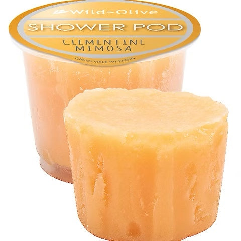Vibrant Wild Olive Shower Pods in mini pots, bursting with eco-friendly exfoliants for a nourishing, luxurious lather.