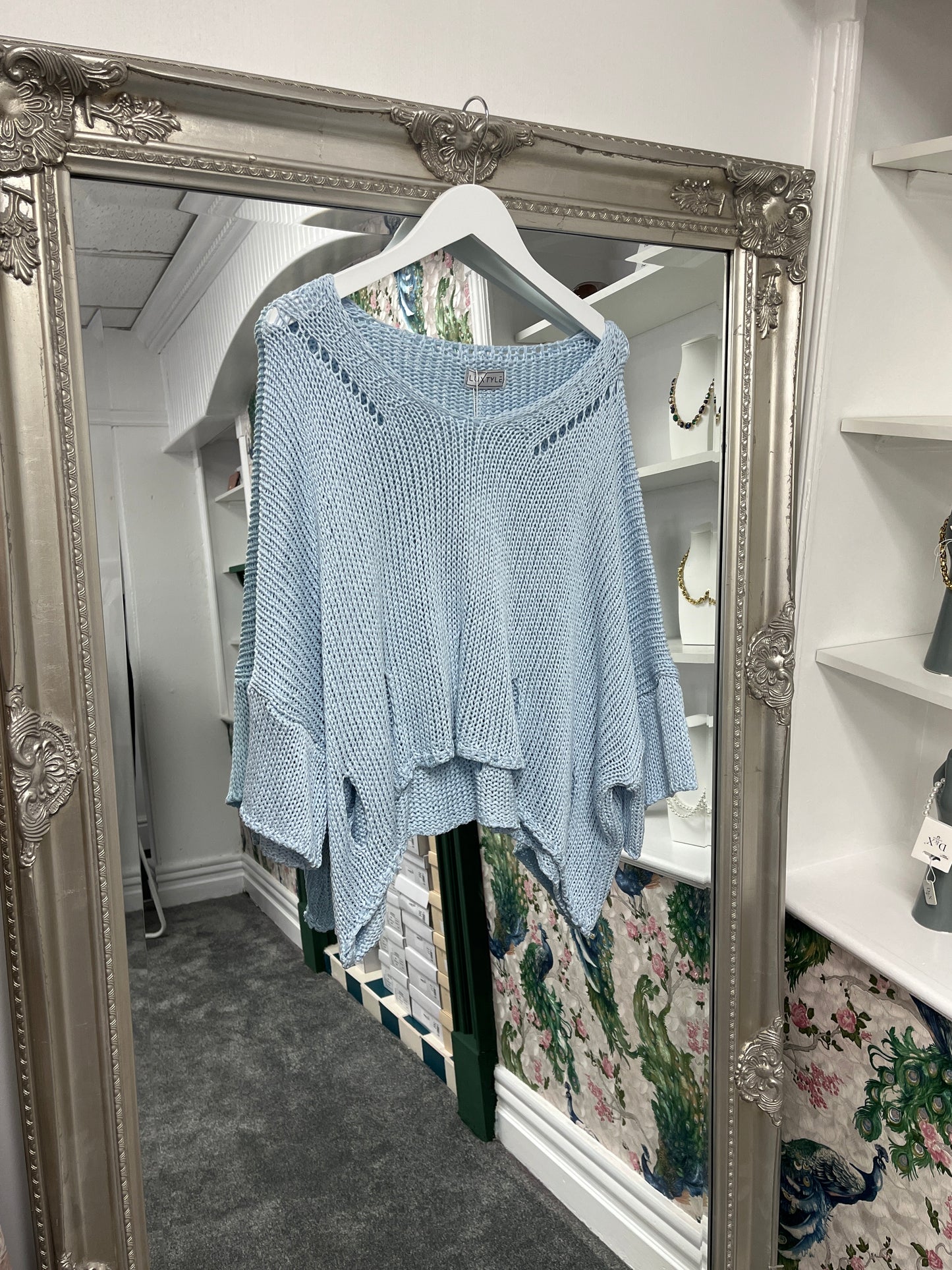 Stylish crochet top with trendy holes, designed to fit sizes 8-14, offering a breezy and versatile look from Luxtyle.