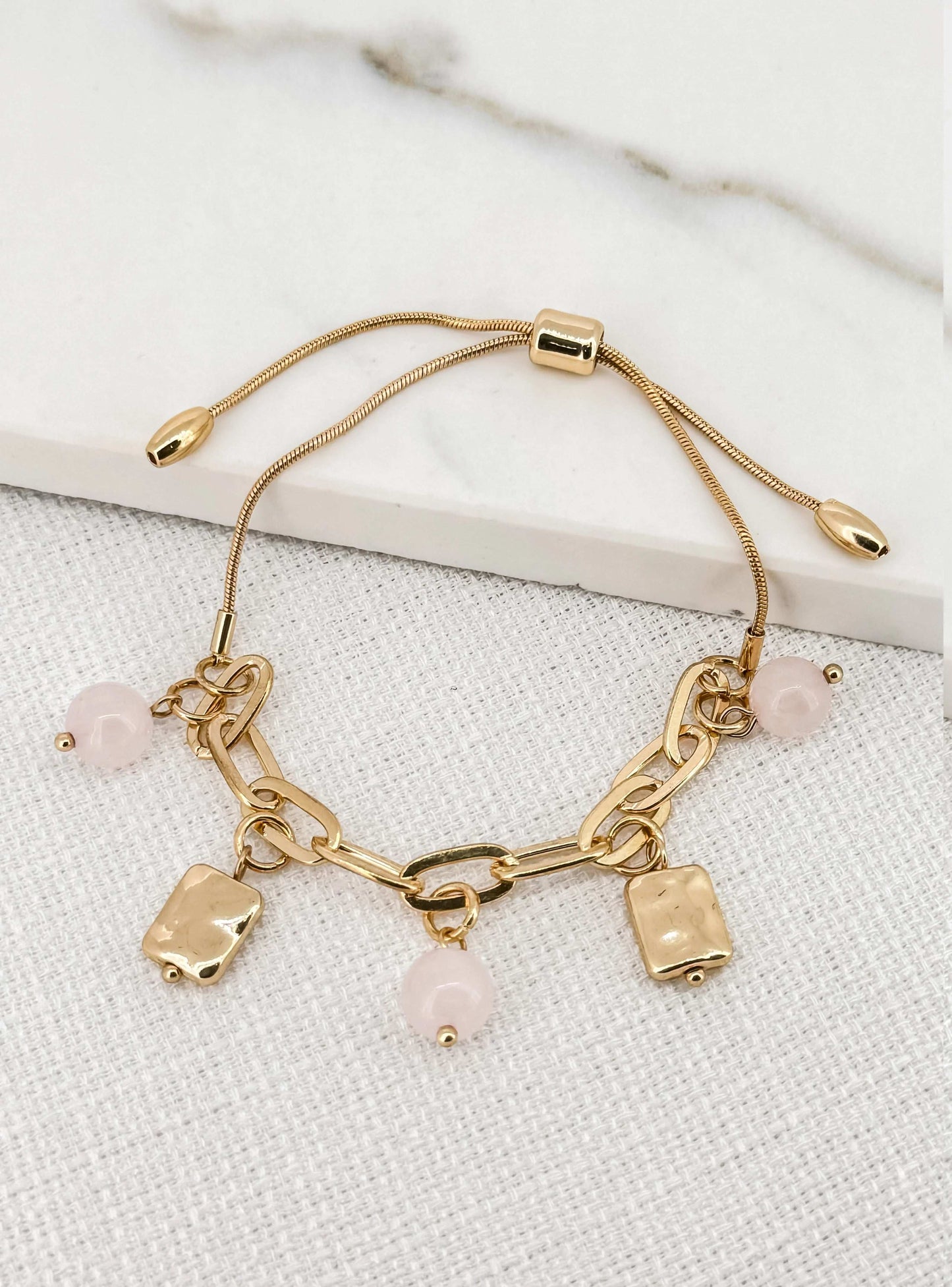 Envy Adjustable gold charm bracelet with faceted glass beads