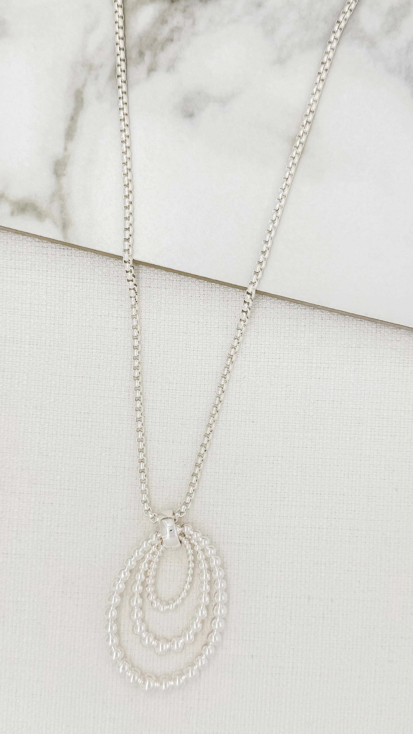 Envy - Long silver chain necklace with oval bobbles pendant