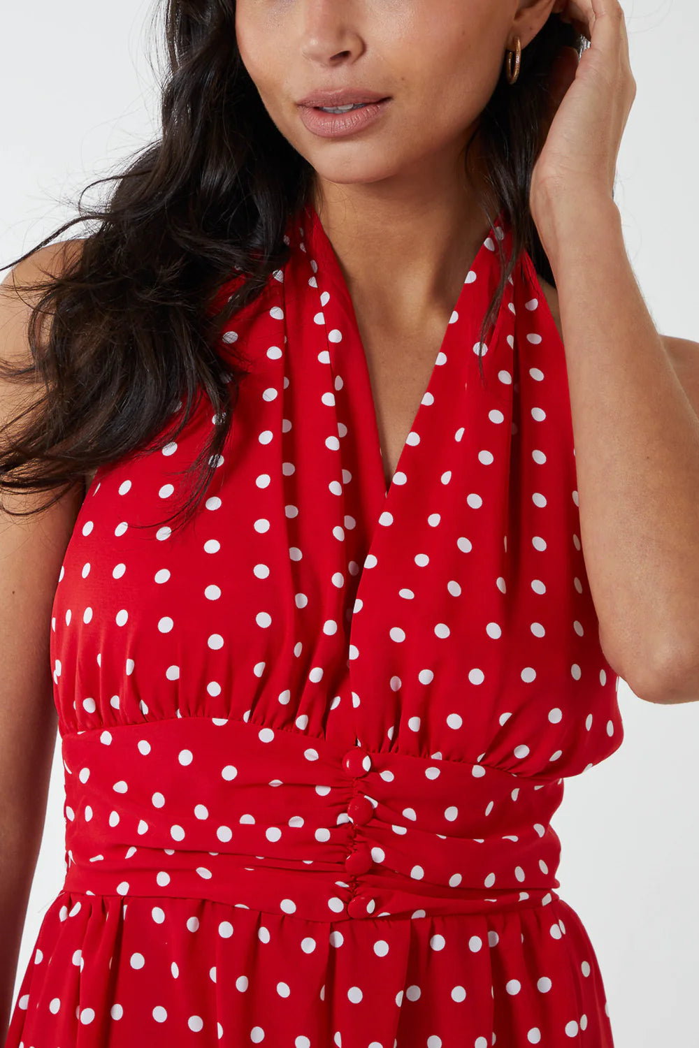 Elegant polka dot maxi dress in size 16, featuring a chic halterneck, button belt at the waist, and flowing skirt.