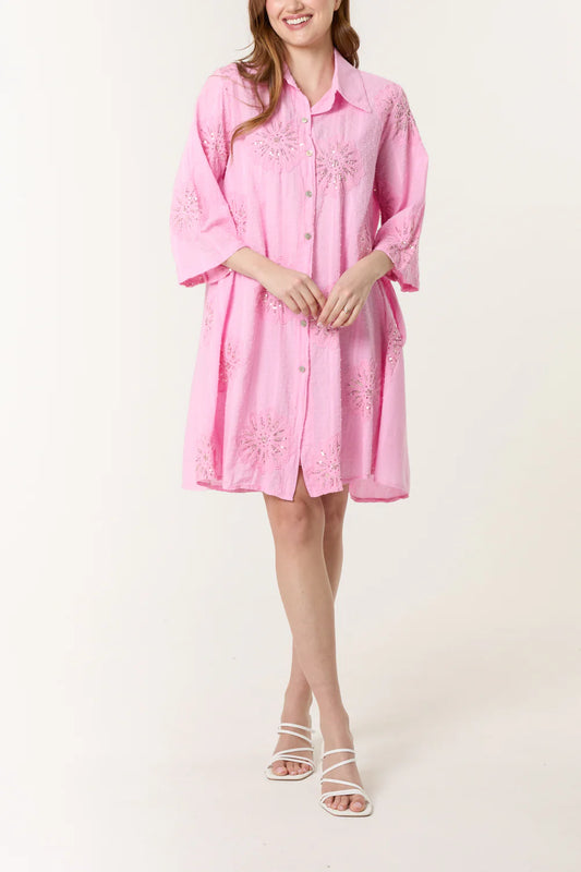 Vibrant sequin daisy patterns adorn this breezy cotton dobby shirt dress, designed to fit UK sizes 8-16 with effortless style.