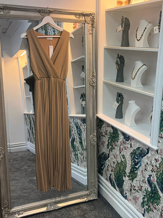Elegant latte-colored pleated sleeveless dress, designed to flatter sizes 8-14 with a flowy, chic silhouette.
