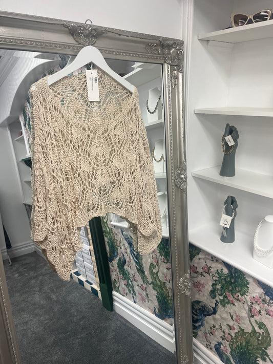 Charming beige cropped crochet top with intricate detailing, designed to fit sizes 8-18 for a versatile, stylish look.