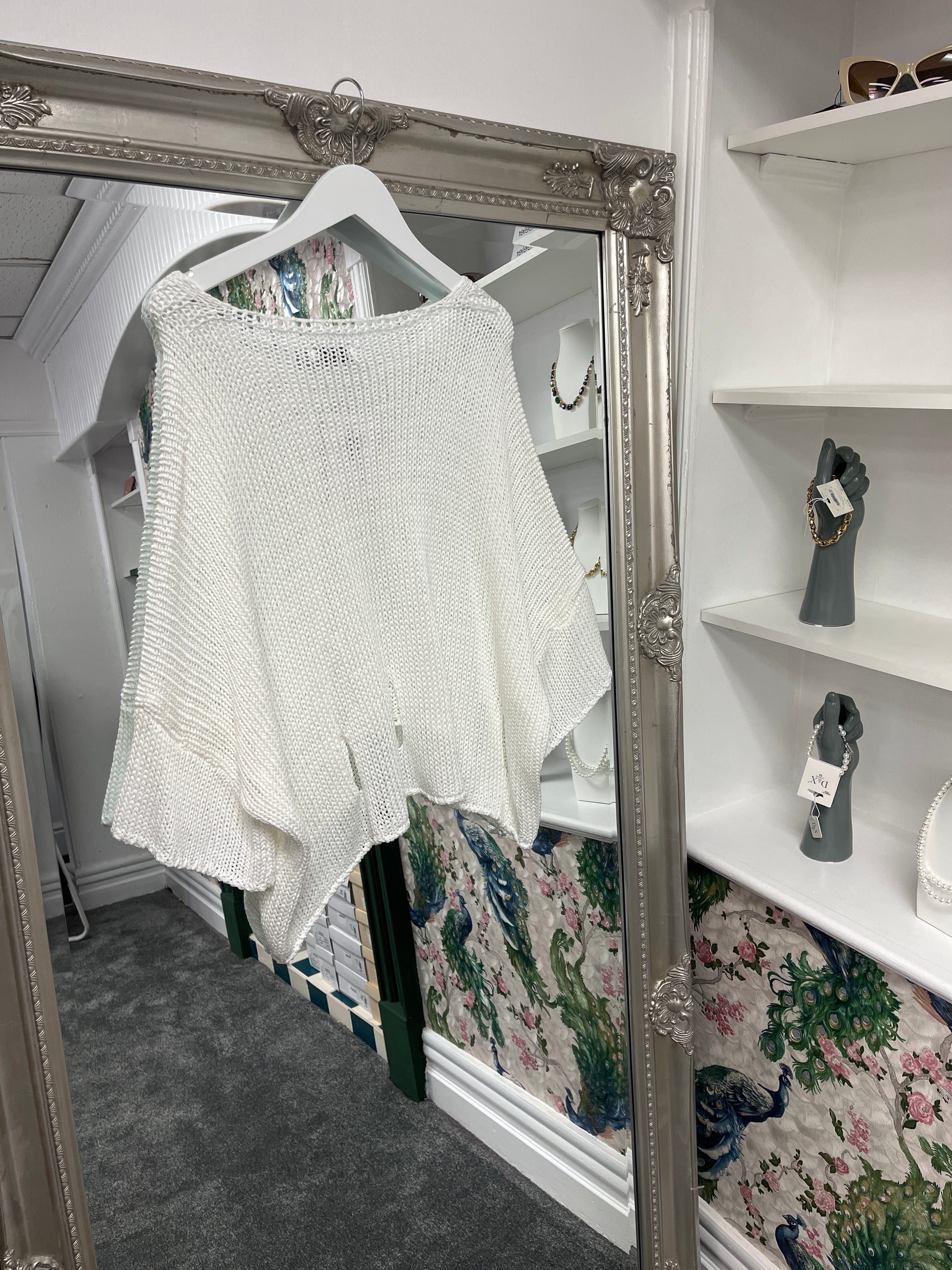 Delicate crochet top with stylish holes, designed to fit sizes 8-14, showcasing a breezy, textured look for any occasion.