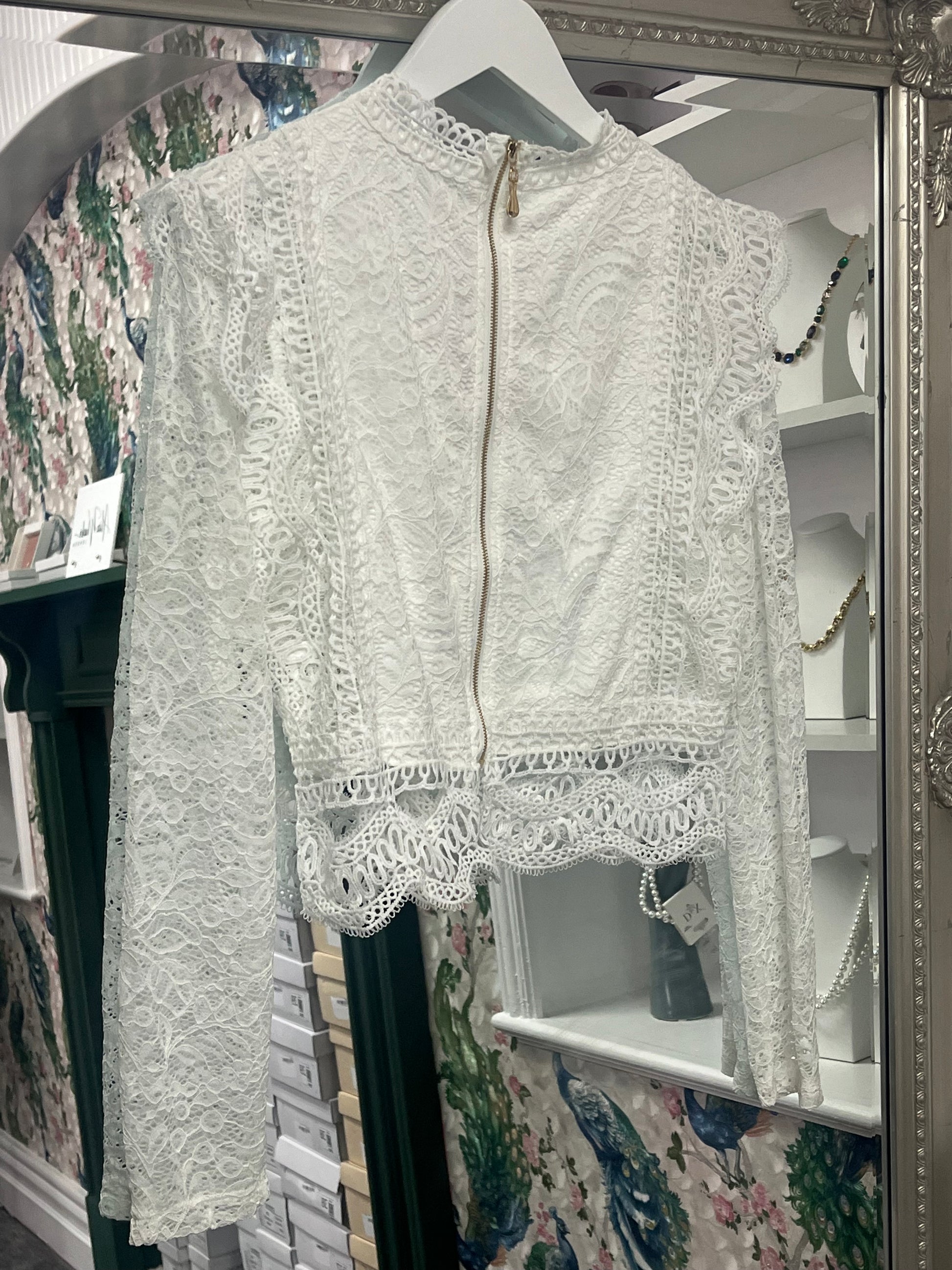 Stylish long-sleeved cropped top from Luxtyle, designed to fit sizes 8-14, with a flattering and versatile silhouette.