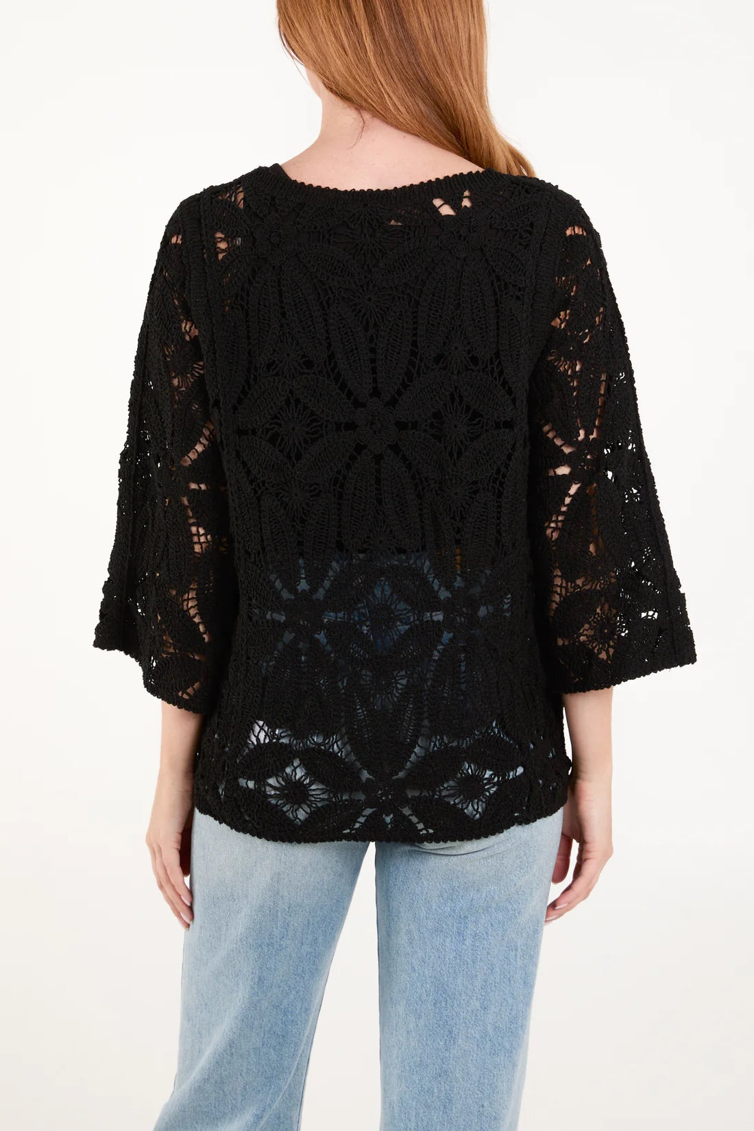 Vibrant wildflower crochet top in soft 100% cotton, featuring intricate floral patterns, perfect for a boho-chic look.
