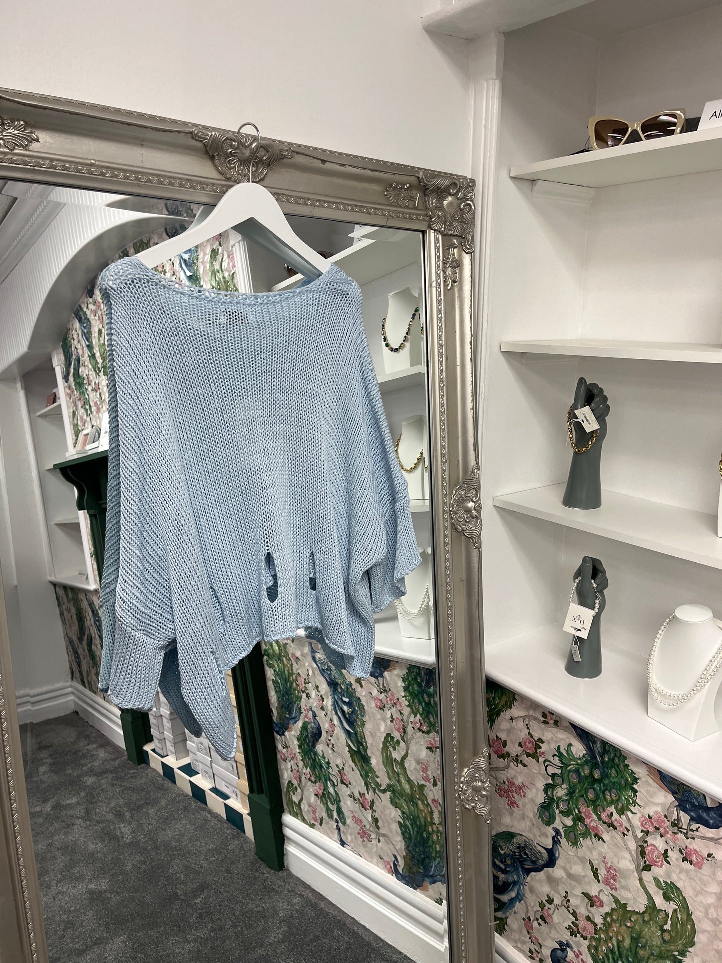 Vibrant crochet top with stylish holes, designed to fit sizes 8-14, showcasing a breezy, textured look for versatile wear.
