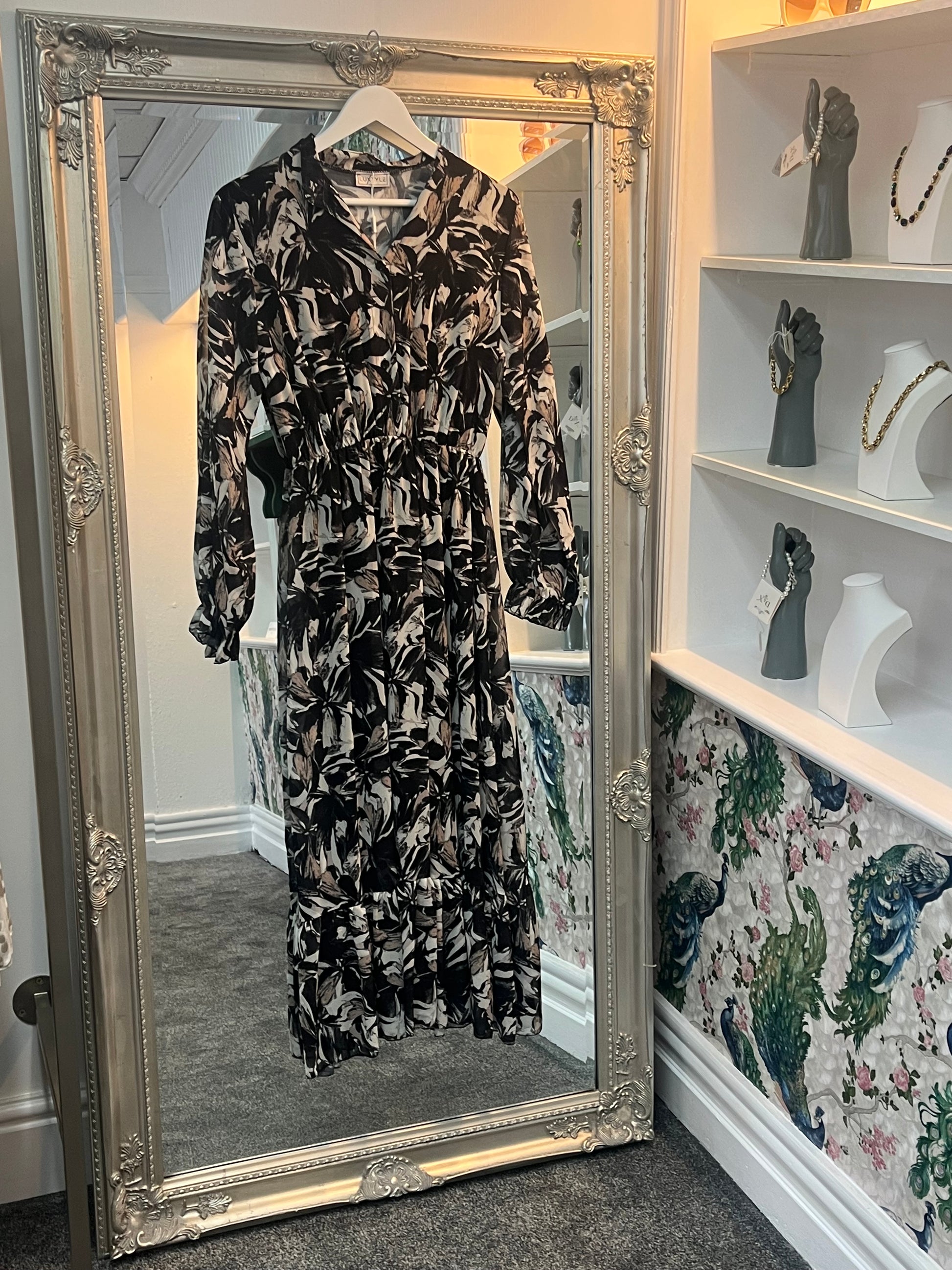 Elegant black longsleeve dress with a stylish pattern, designed to flatter sizes 8-14 with a versatile, comfy fit.