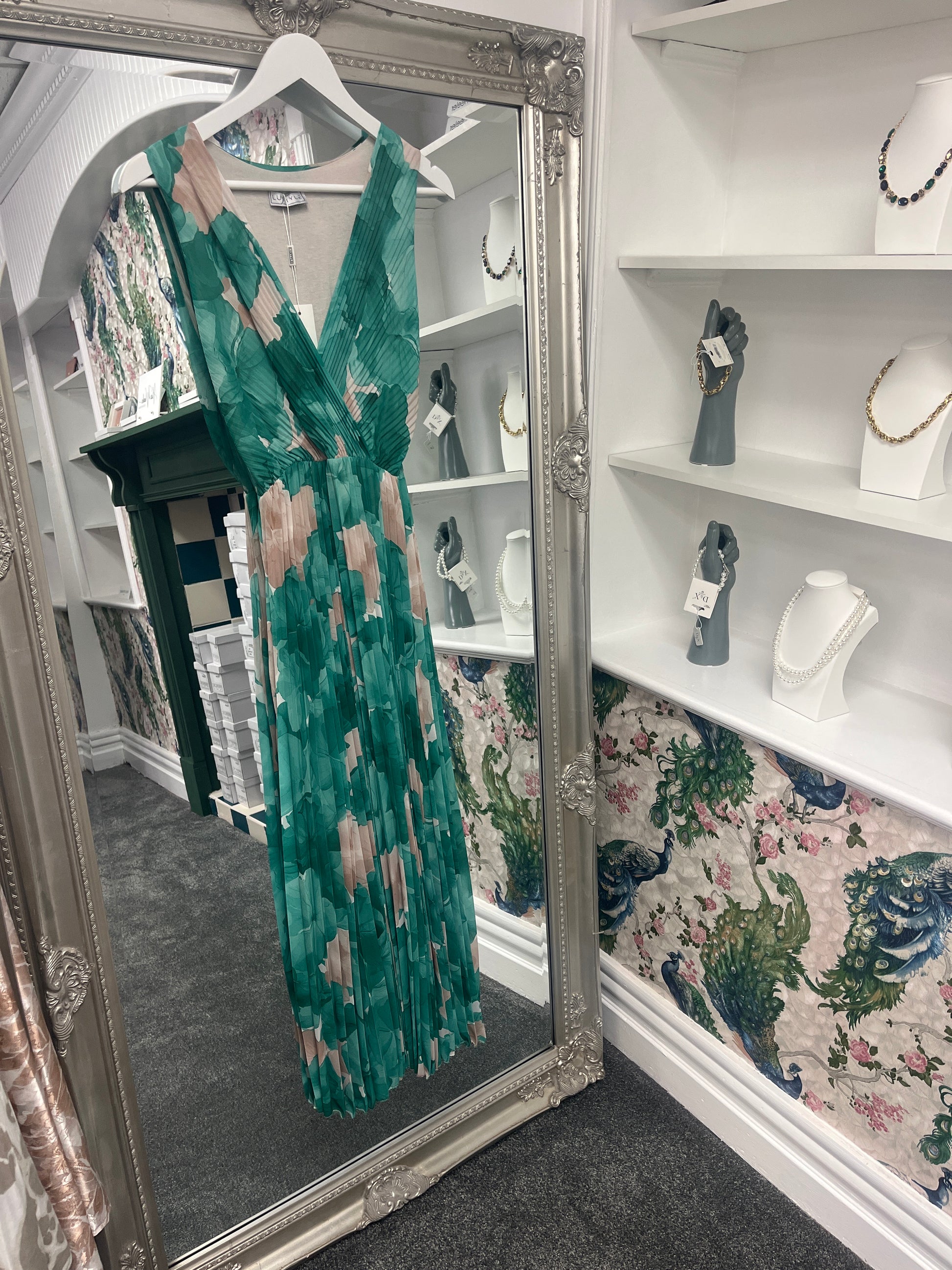 Vibrant green pleated floral dress with a flattering fit for sizes 8-14, featuring delicate patterns and a flowy design.