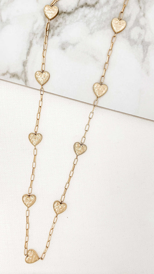 Envy - Long gold necklace with battered hearts