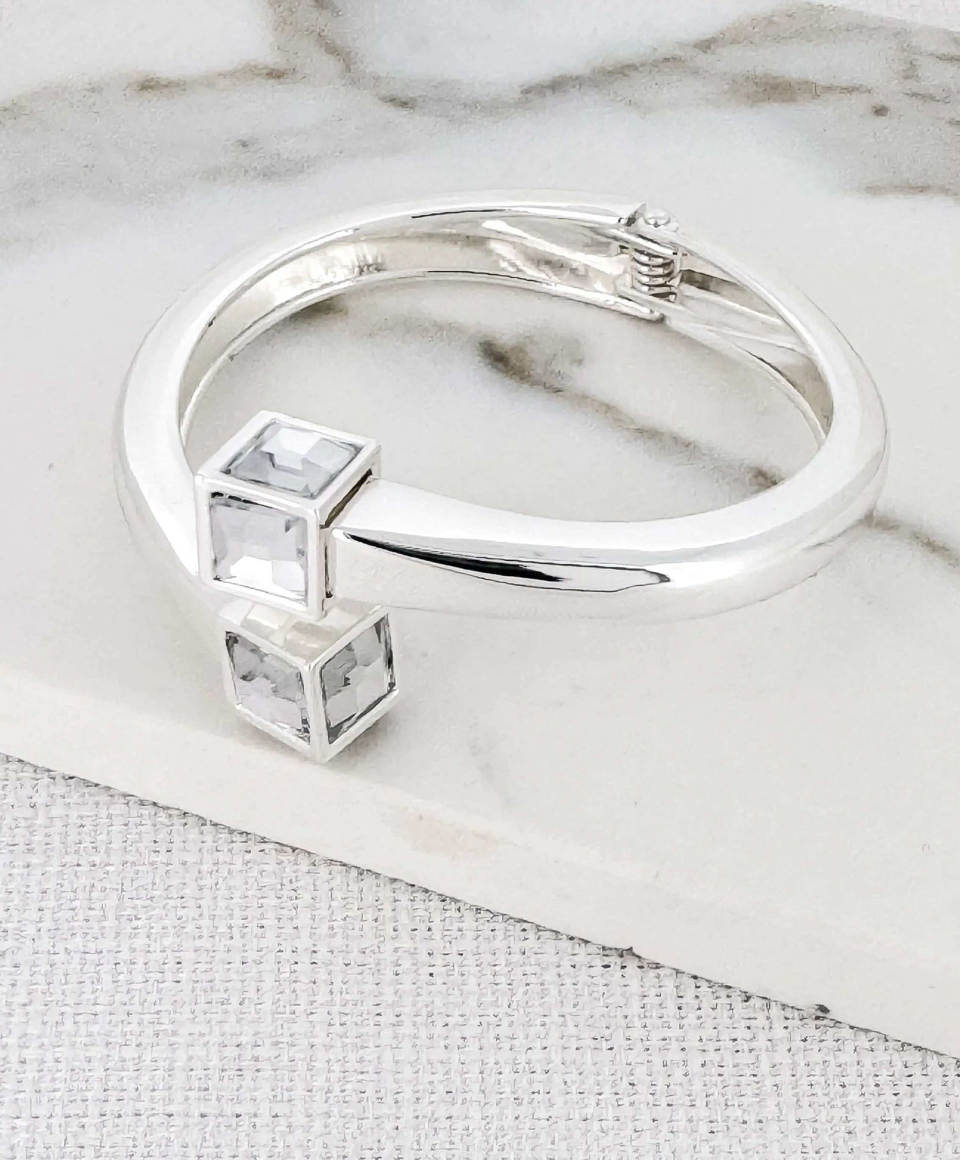 Envy - Silver hinged bangle with clear crystal cube design