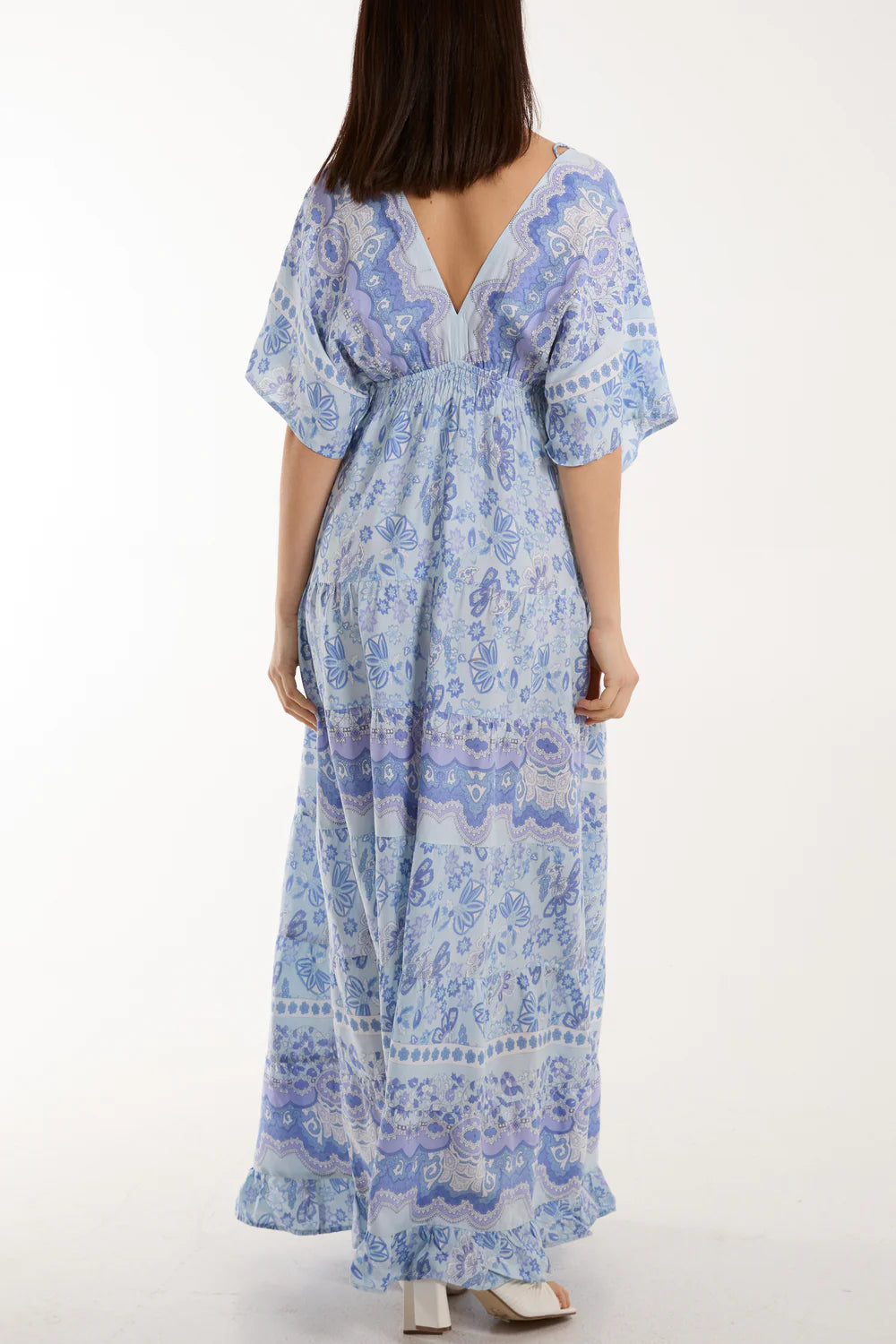 Flowing V-neck dress in mixed prints with playful tassel details, crafted from breezy 100% viscose for a chic look.