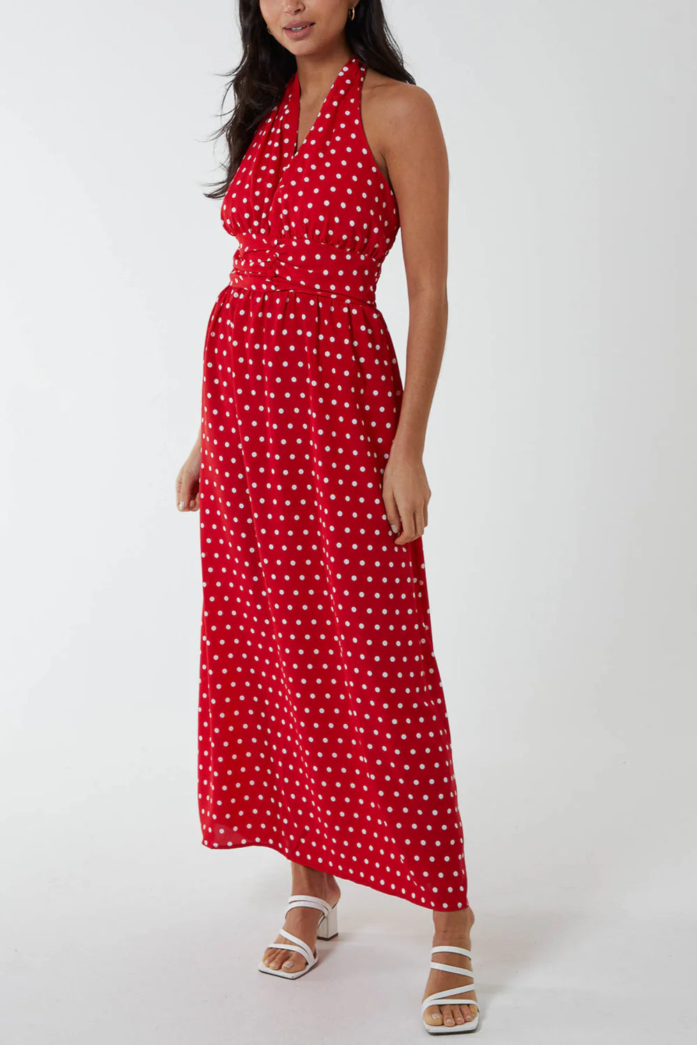 Elegant polka dot maxi dress in size 16 with a halter neckline, button belt at the waist, and a flowing vintage skirt.