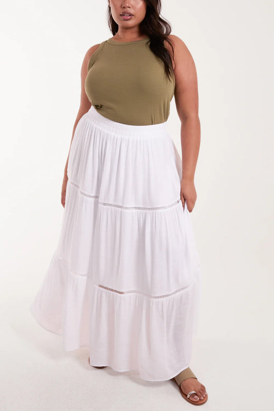 Flowing curve maxi skirt in a lightweight fabric with unique ladder tiered detailing and a comfy elastic waist.