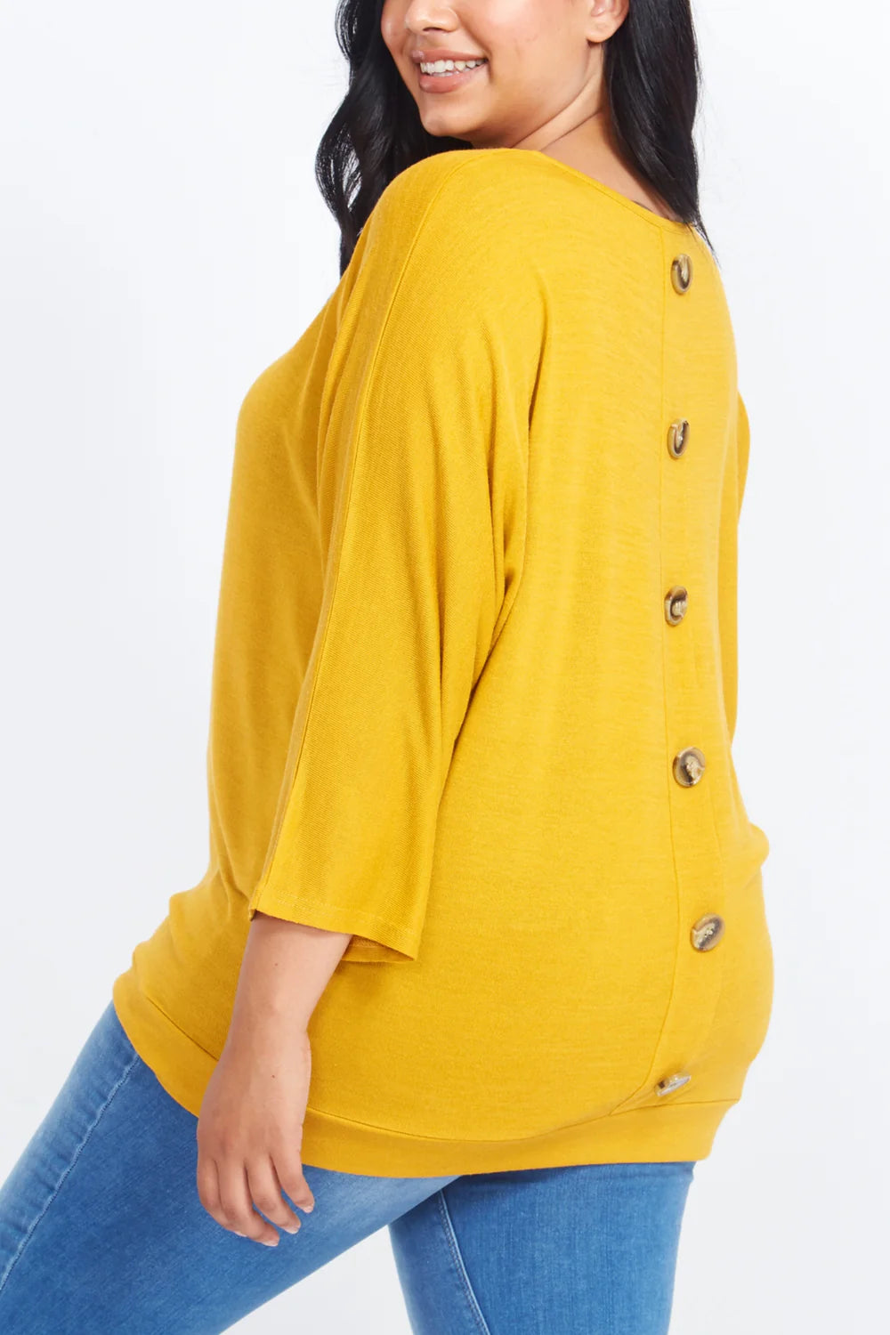 Stylish long sleeve top in size 26-28 with a unique curved button-back design, crafted from a soft polyester blend.
